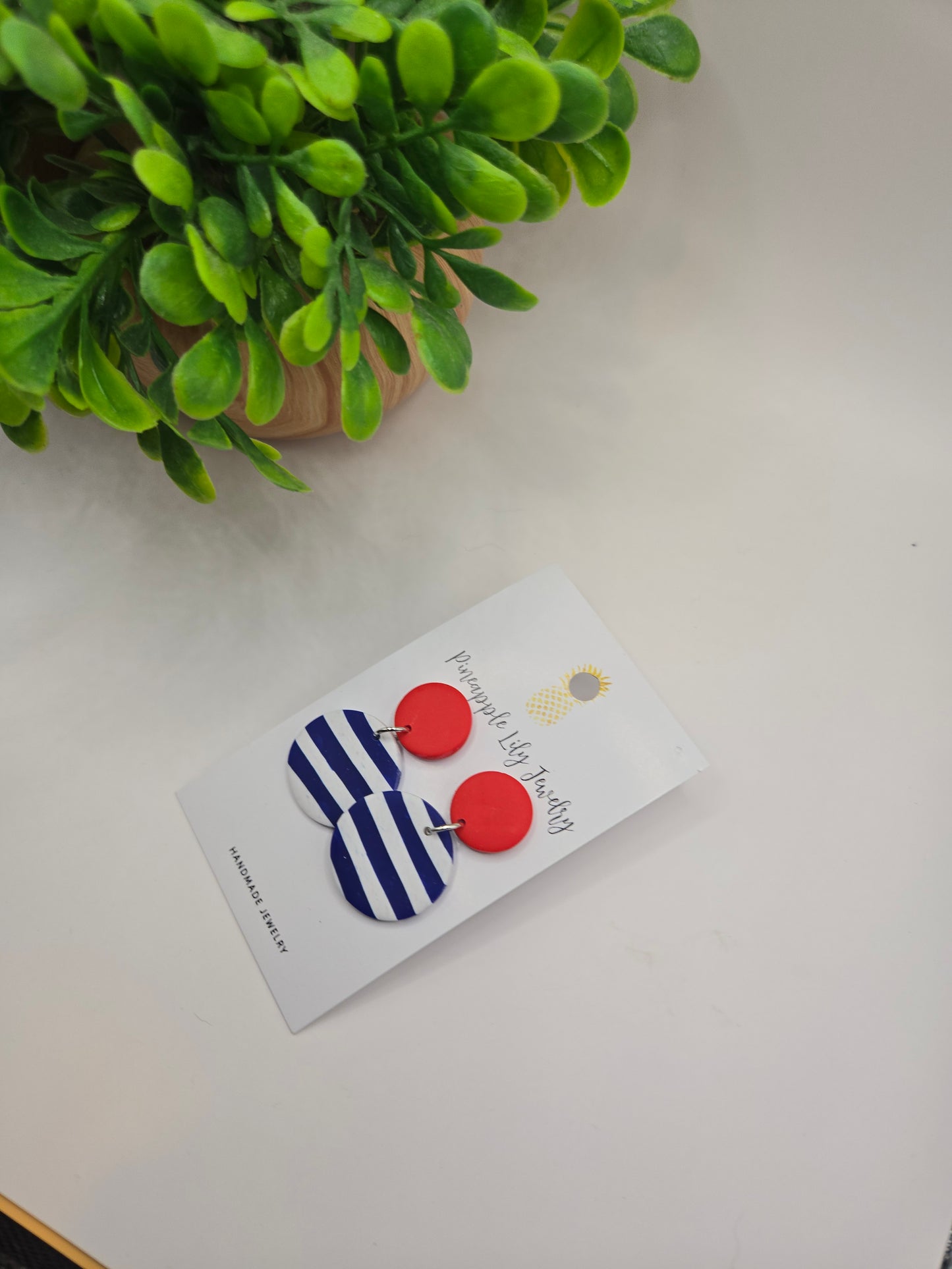 The "Lucy" red button with Stripes polymer clay earrings