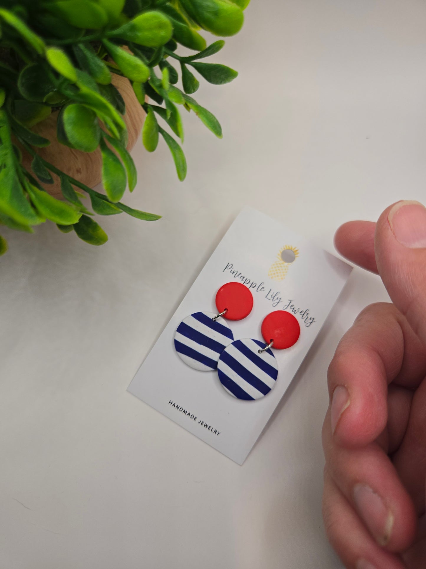 The "Lucy" red button with Stripes polymer clay earrings