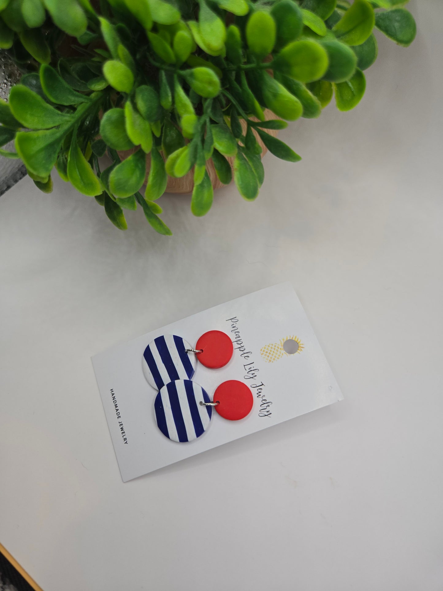 The "Lucy" red button with Stripes polymer clay earrings