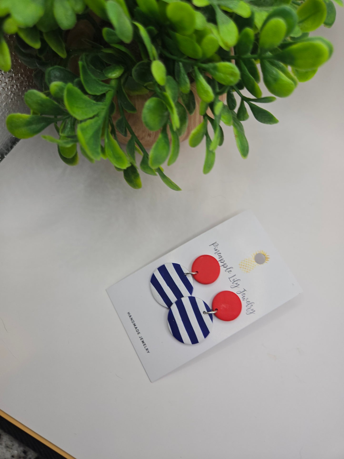 The "Lucy" red button with Stripes polymer clay earrings