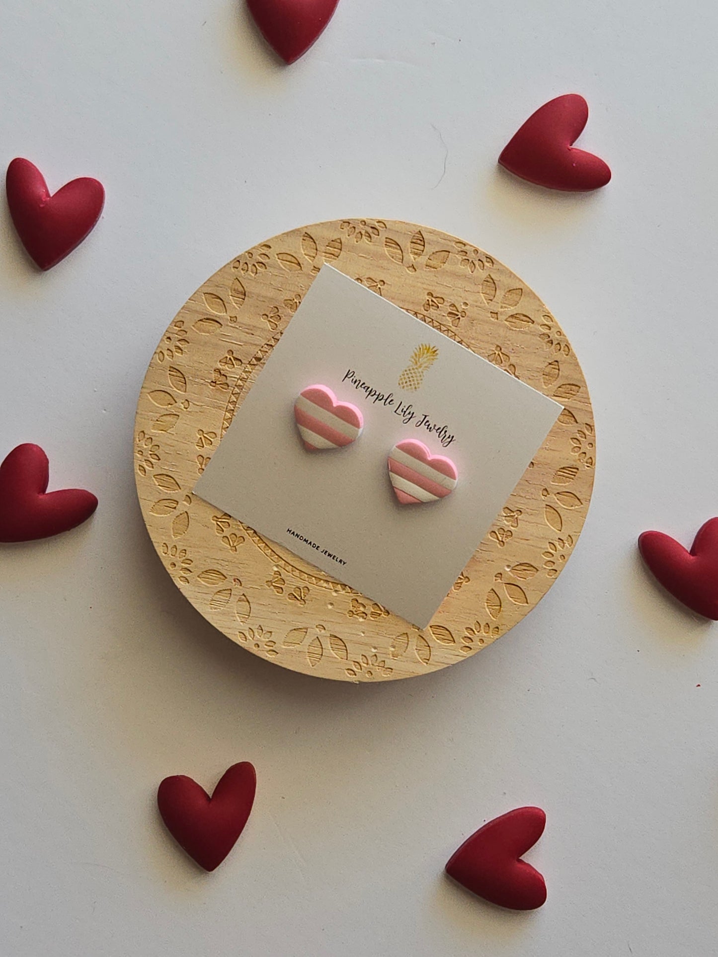 Pink and white stripe heart studs