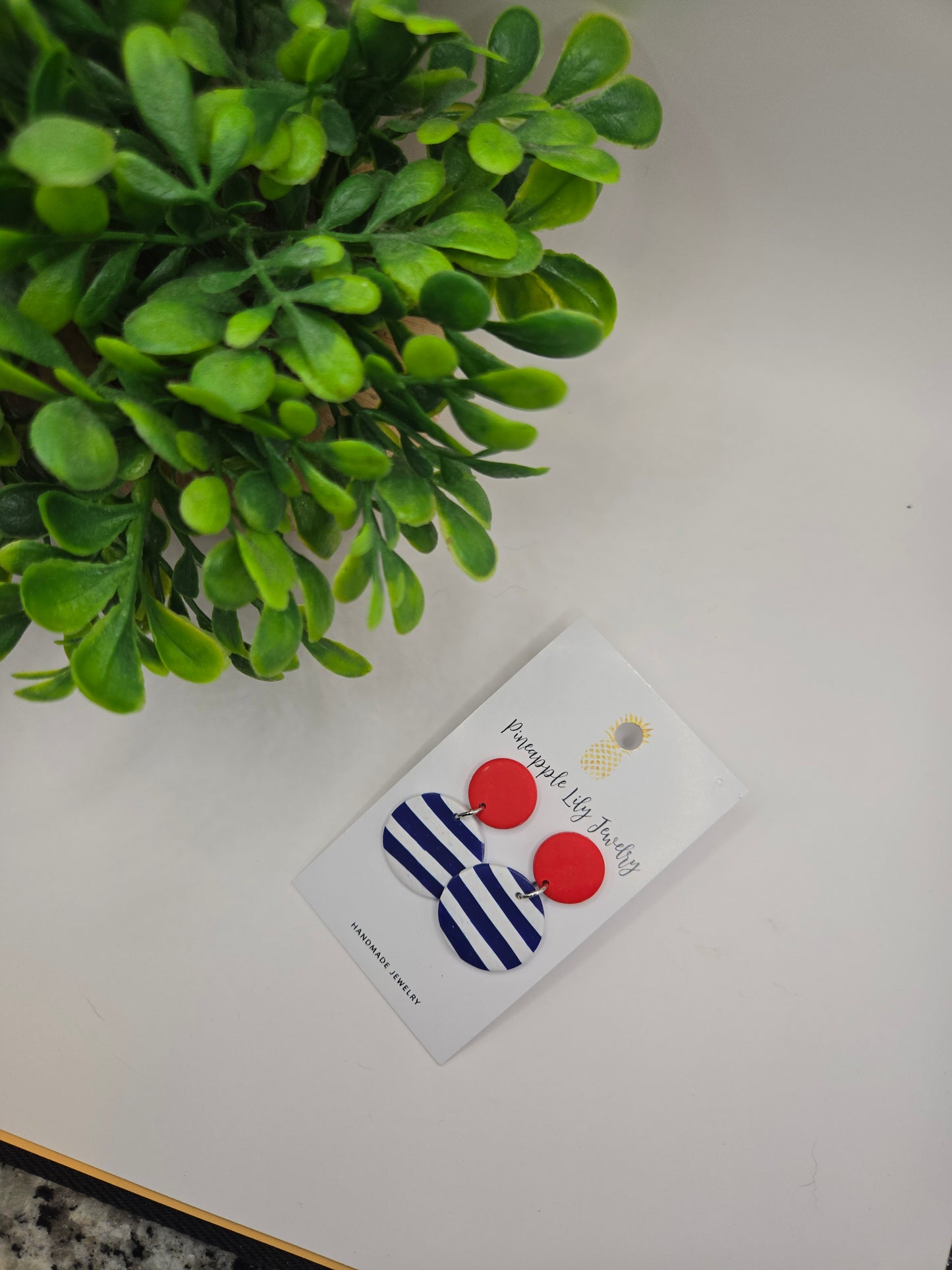 The "Lucy" red button with Stripes polymer clay earrings