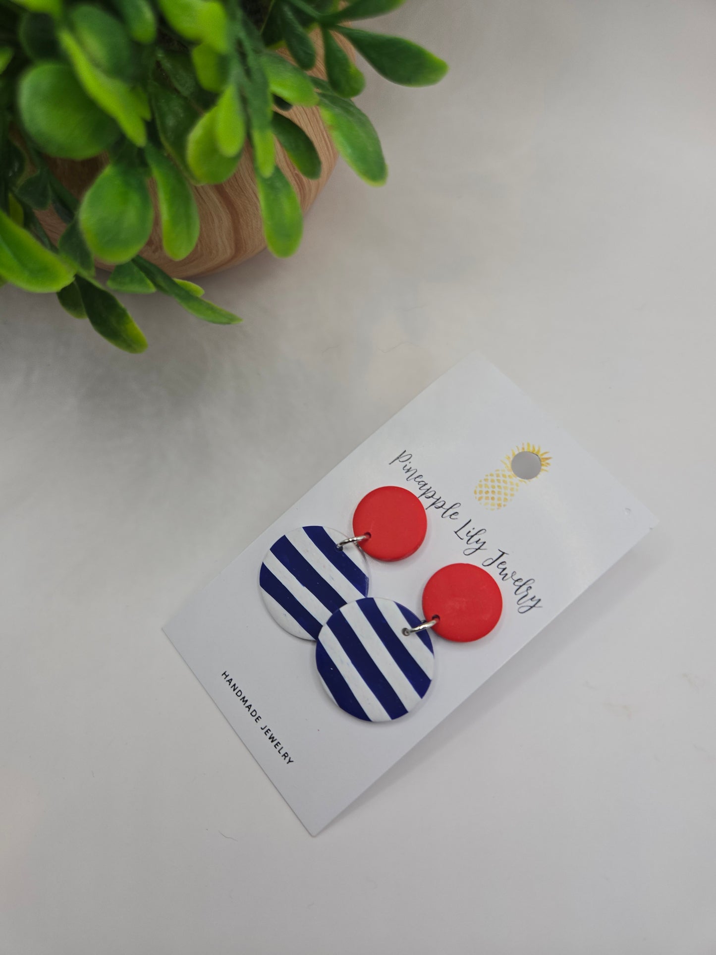 The "Lucy" red button with Stripes polymer clay earrings