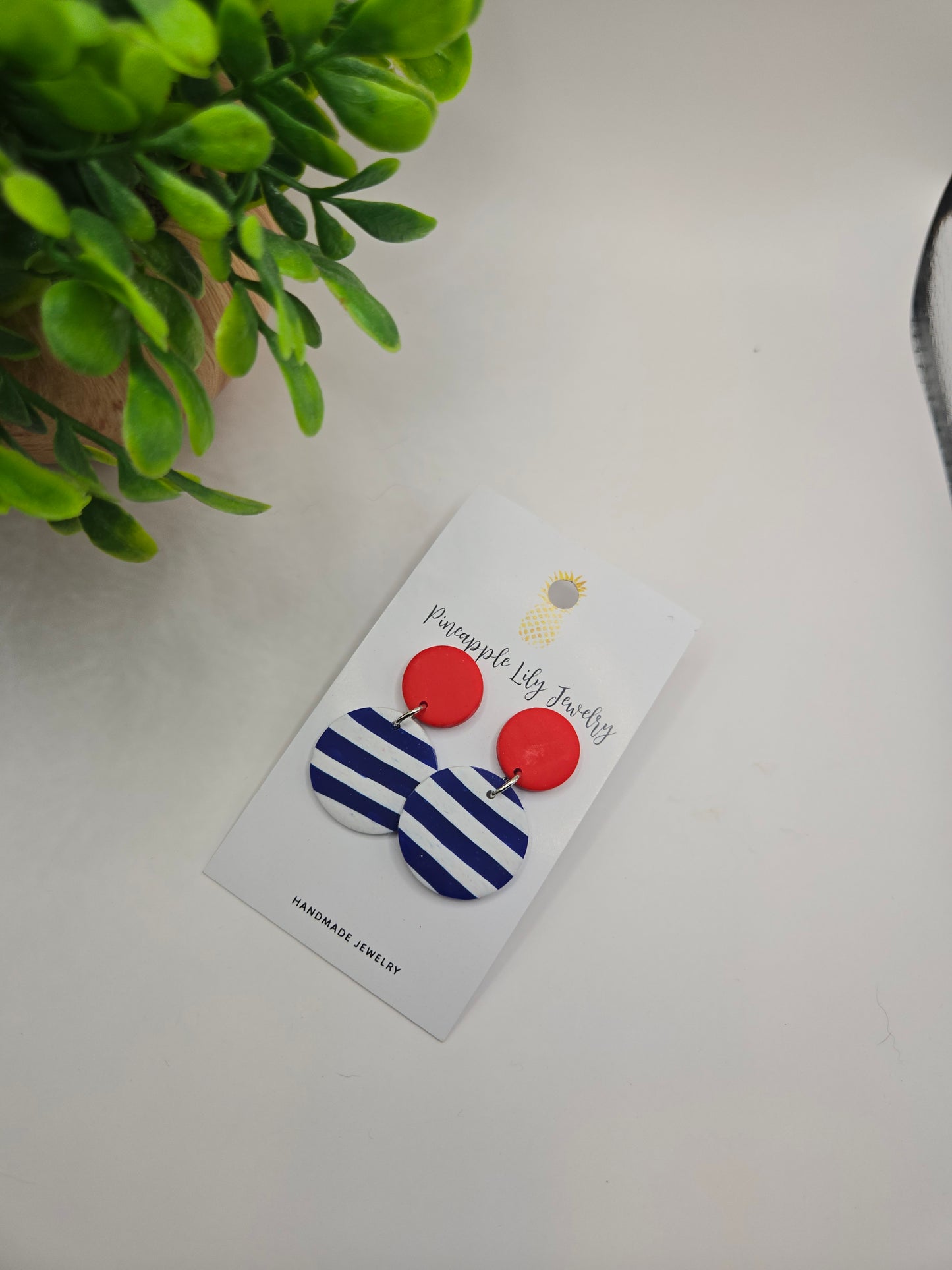 The "Lucy" red button with Stripes polymer clay earrings