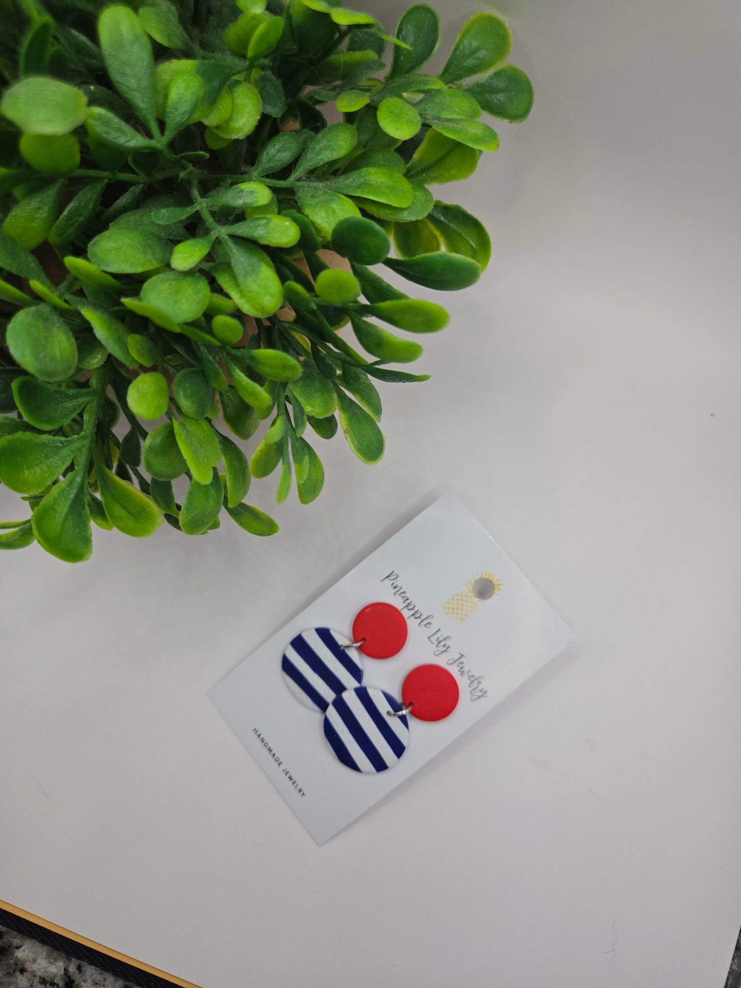 The "Lucy" red button with Stripes polymer clay earrings