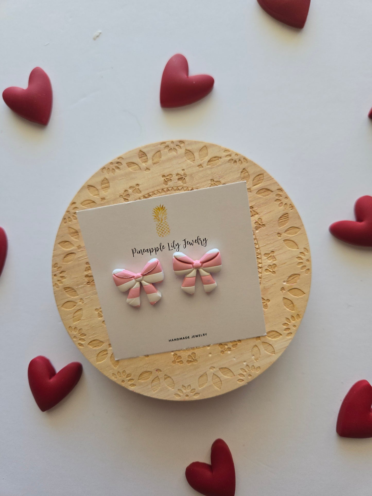 Pink and white stripe bow studs