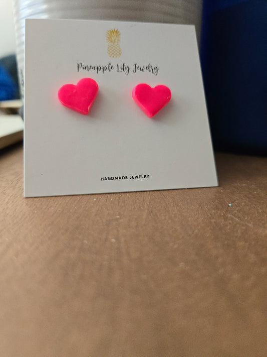 Bright pink heart studs