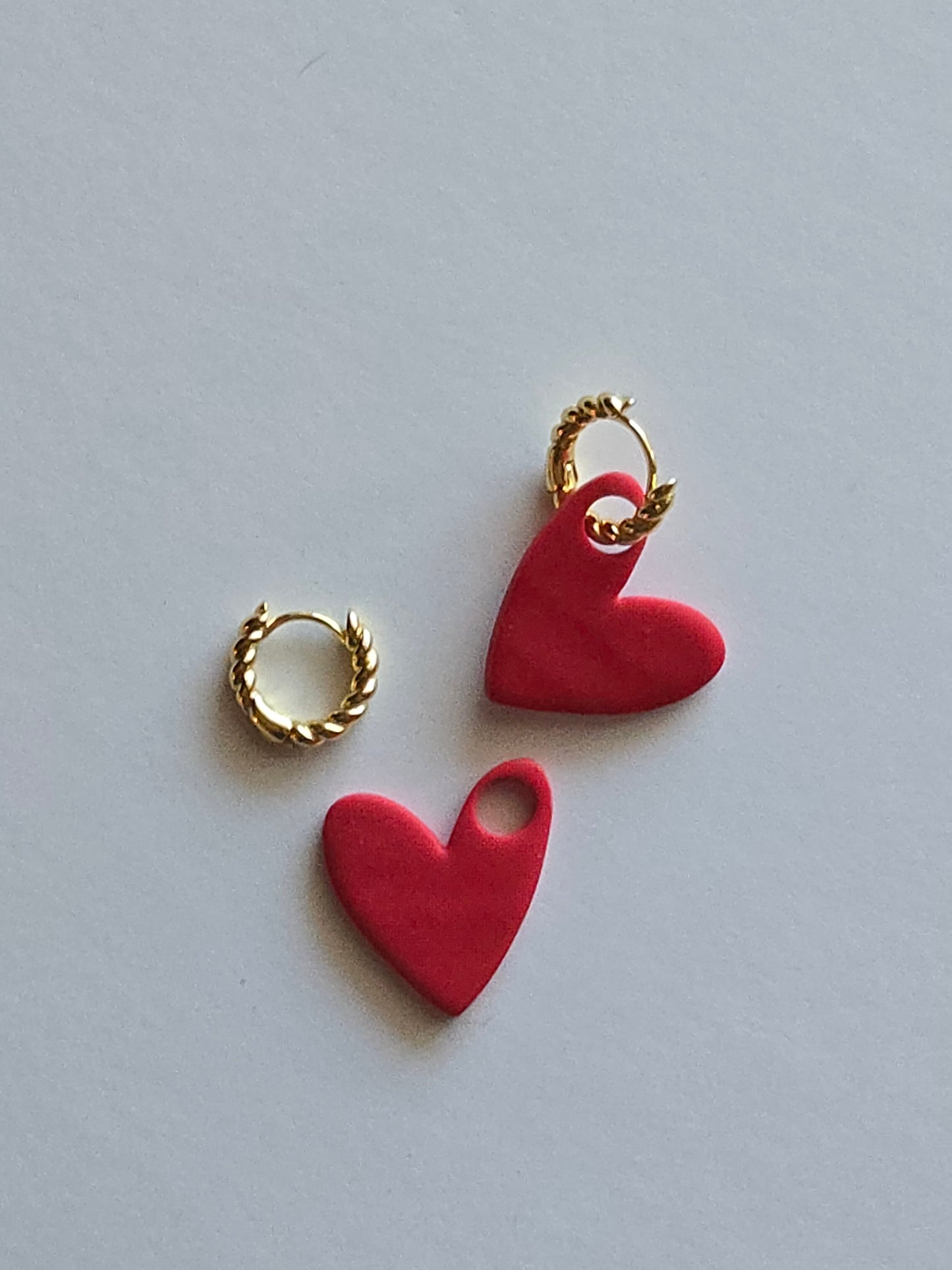 Interchangeable hoop earrings with heart dangles