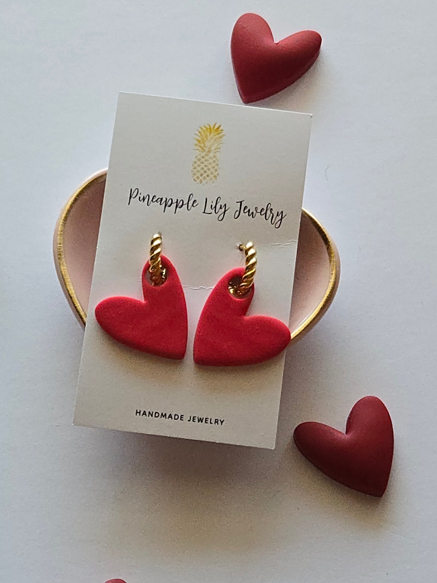 Interchangeable hoop earrings with heart dangles