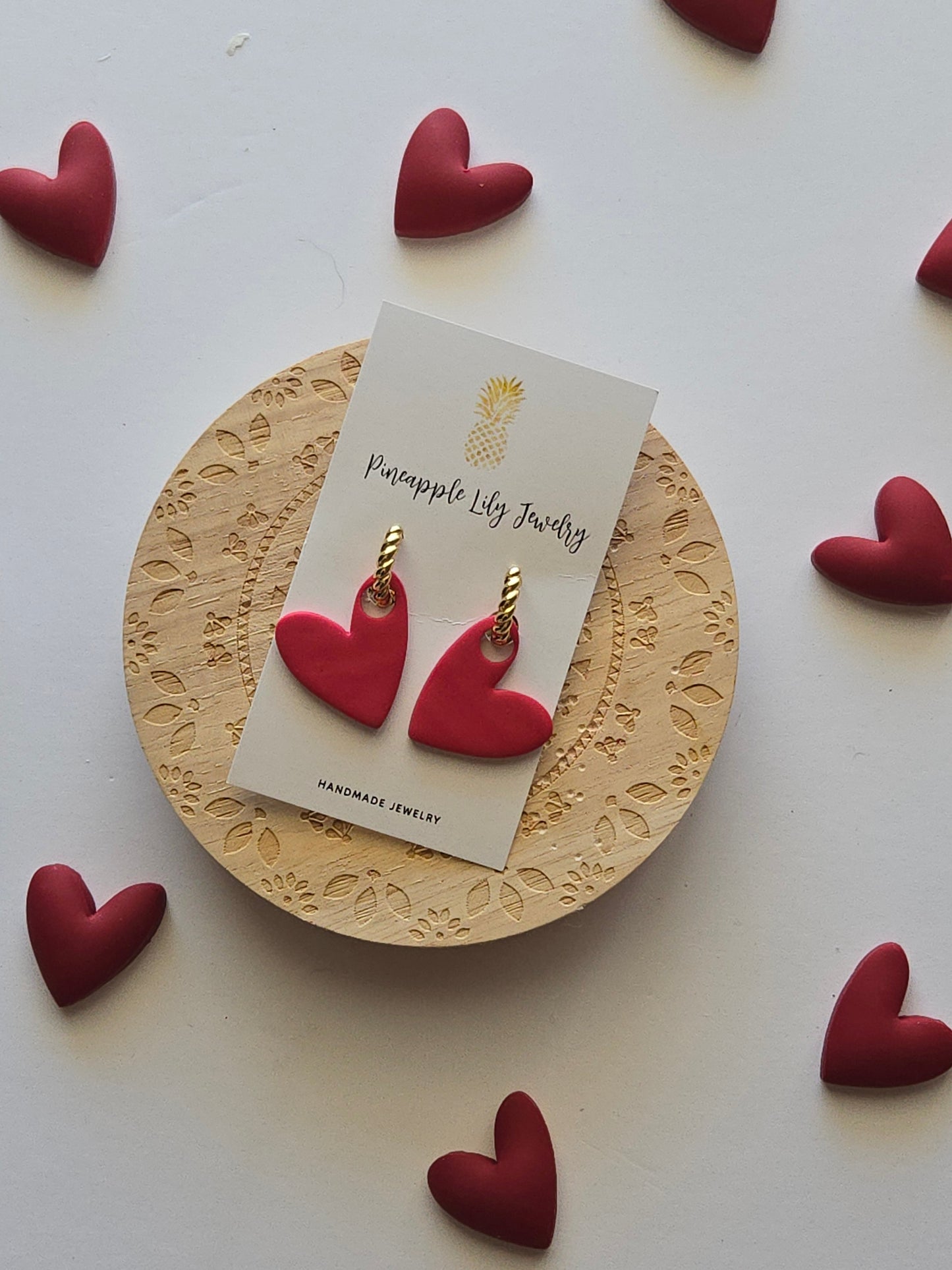 Interchangeable hoop earrings with heart dangles