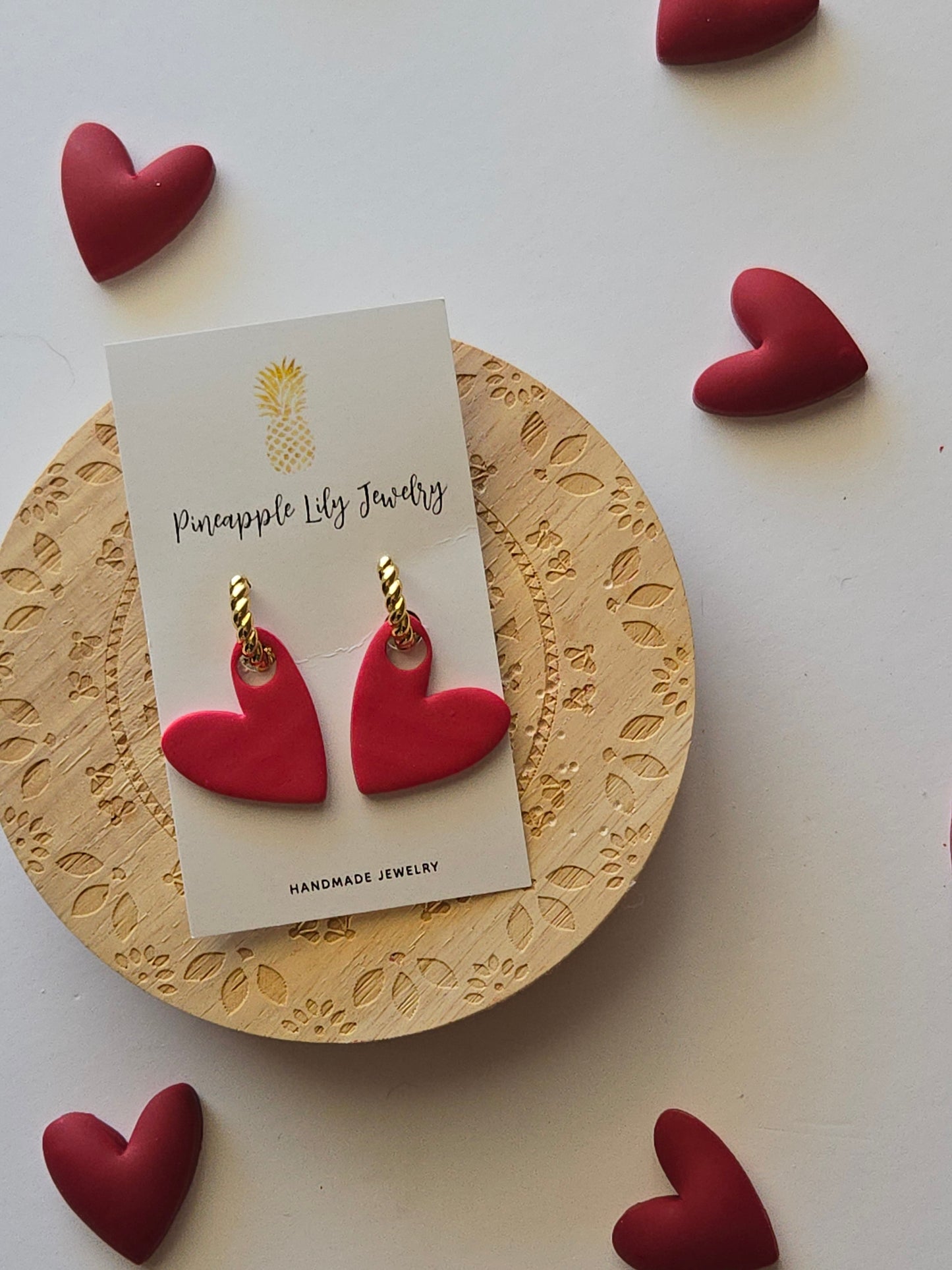 Interchangeable hoop earrings with heart dangles