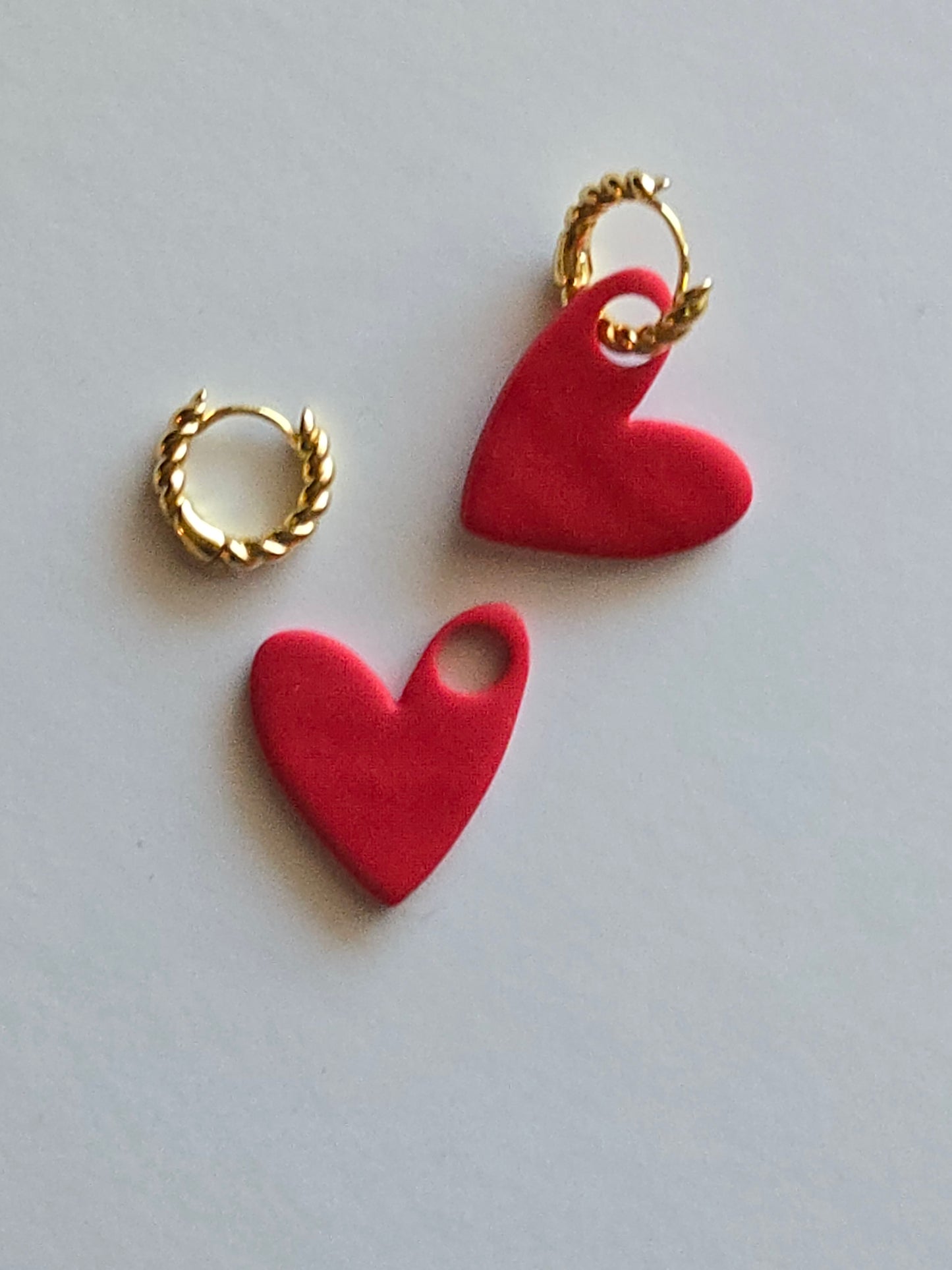 Interchangeable hoop earrings with heart dangles